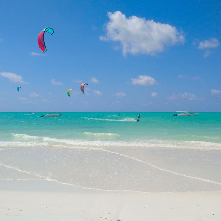 Guests swimming at Paje Beach